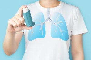 Person With Asthma Inhaler