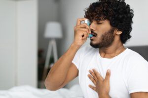 Person With Asthma Inhaler